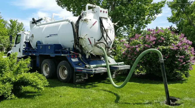 Professional vacuum truck performing residential drainage and septic maintenance in Chandler, AZ