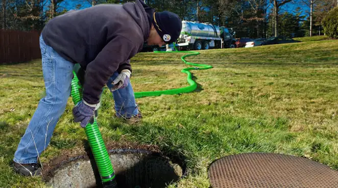 Service technician performing residential septic pumping and drainage maintenance in Chandler, AZ